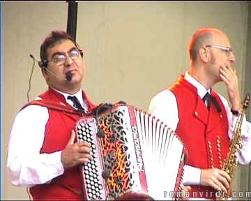 Two musicians of a trio playing local folk music during vine fair festivities