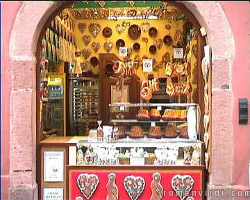 Riquewihr bakery selling delicious sweets and cakes. The most famous are the round Kugelhupfs, which you can see in the glass box at the center of the picture