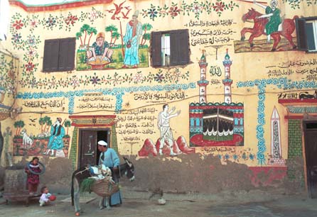 A colourful house near Luxor depicting daily life, including a Hajj to Mecca at the center