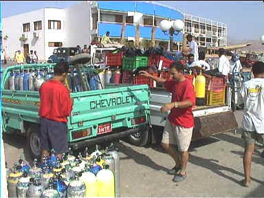 Busy 
Naama Bay harbour, lots of air tanks being unloaded in the morning for 
the diving day tours by boat