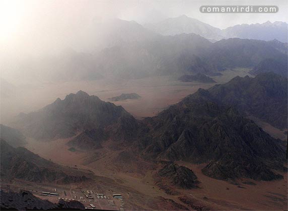 A 
sandstorm approaching these desert hills