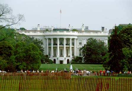 The white house with the line of people waiting for the tour