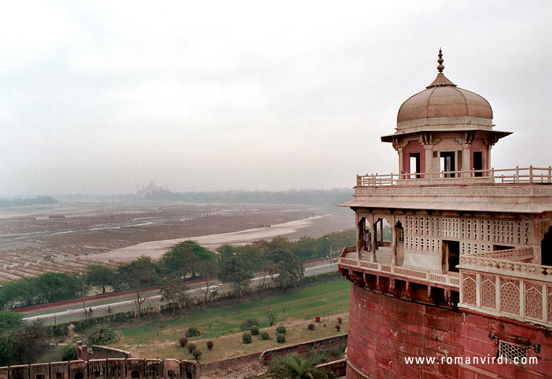 View from the Red Fort. The slight pointed elevation in the misty horizon is the silhouette of the Taj Mahal