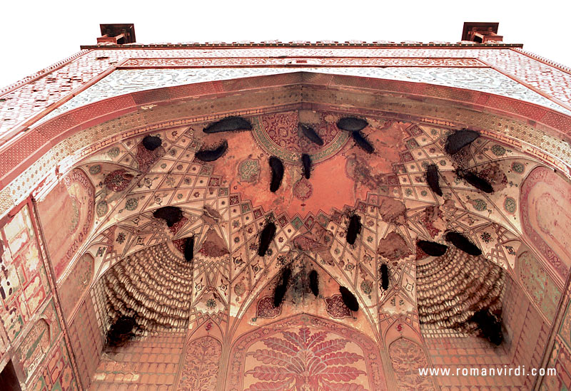 Beehives cling like leaches to the roof of one of the side gates of Sikandra