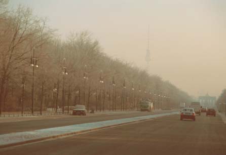 The wide 'Strasse des 17. Juni' road, with the Brandenburger Tor and the TV Tower in the distance