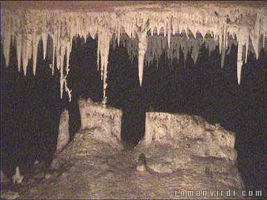 Deep inside Gruta da Torrinha. Large parts of the ceiling have dropped to the floor as enormous slabs of rock, which sometimes move when you walk over them