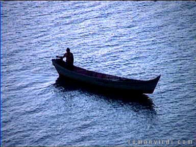 Fisherman at dusk on Penedo's river