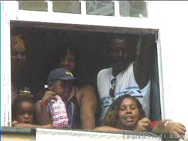 Whole family looking down from the balcony