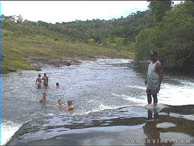 I'm on the top of the waterfall now, feet in the water