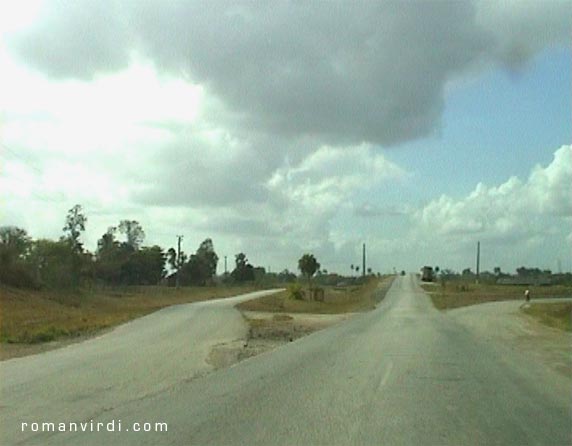 Cuban road forks in different directions (left, center, right, all unmarked, of course)