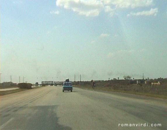 Isn't this cool? Sugarcane Train over 6-lane Highway to Havana with nary a railway-crossing sign in sight