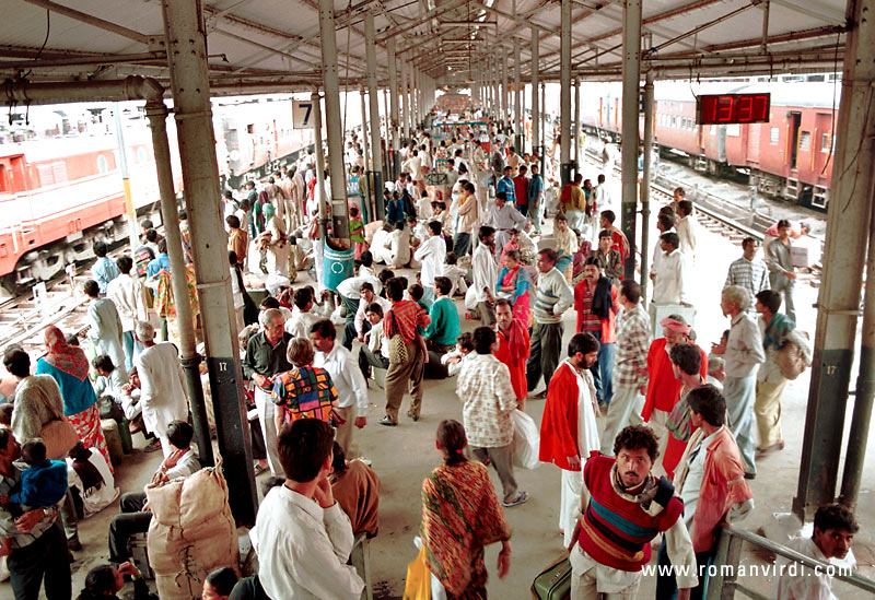 This is one of the platforms of Old Delhi railway station. There are usually lots of people with amusing pieces of household belongings milling around in India's railway stations. The Indian Railways is the world's largest employer.. 