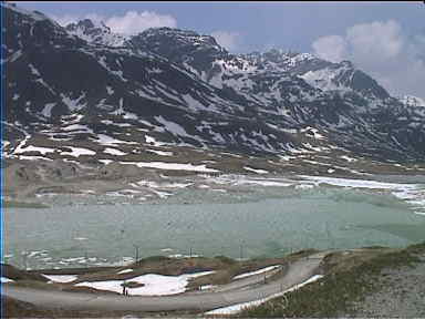 A lake at the top of a pass in Switzerland