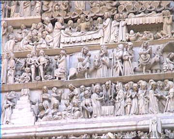 The amazing entrance door of the Collegiate Church in Thann is composed of 150 scenes and 500 characters. Here's a small part of it showing the detail  