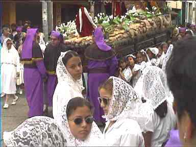 Girls at Easter procession carrying float