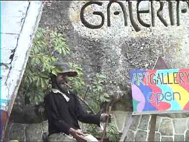 Effigy of Maya God Maximon with cigar outside art gallery in Panajachel