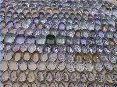 So many souvenir plates for sale at the beach