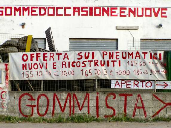 Tire specialist touting his services outside Cagliari