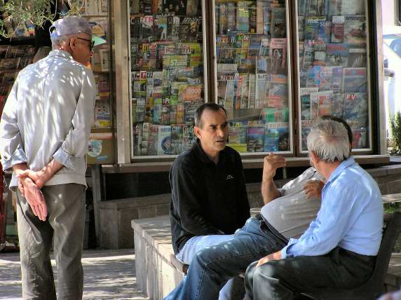 A serious discussion on the town square in Pula