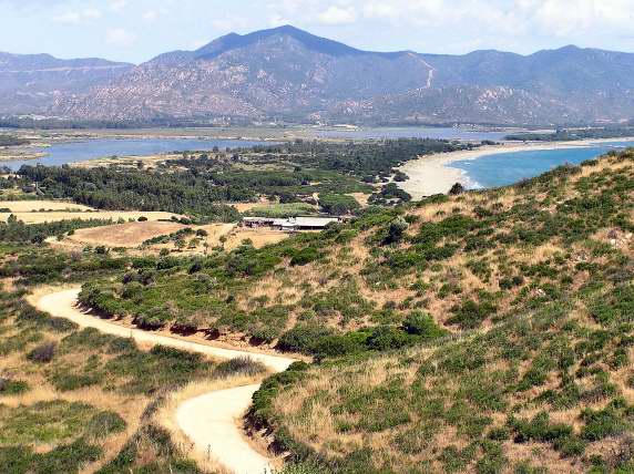 Wild landscapes near Stagno di Feraxi in South Eastern Sardinia require driving along a bumpy, stony, untarred path