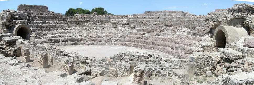 The theater in Nora. The site was founded by the Phoenicians in 8th century BC, later inhabited by the Punics and Romans. It's at a wonderful location on a land tongue jutting out to sea. A refreshing sea breeze blows over the whole area which has water on 3 sides of it