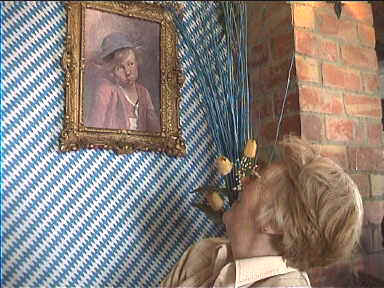 Mom eyeing picture at Bavarian Restaurant in the hills around Parcent