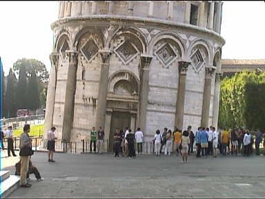 People waiting to climb to the top of the tower. Look at the lean