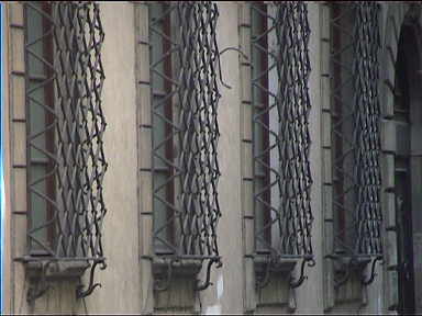 Huge old iron gratings protecting windows can be seen all over town