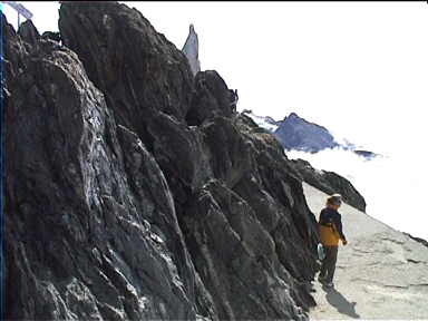 At the top, look at the stark slate rock