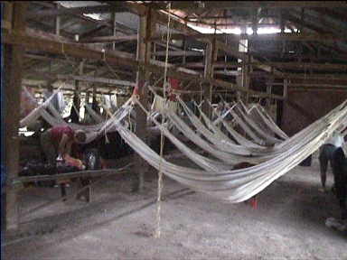 We sleep in Hammocks for two nights in this shed with a corrugated roof and a dust floor