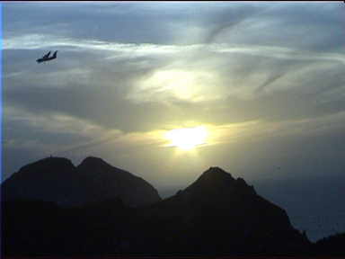 Plane silhouette while sun is setting