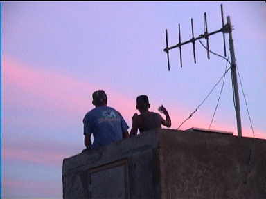 Two kids doing great rap on their own at sunset