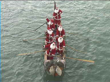 These Santa Clauses had Christmas music blaring while boating under Rialto bridge