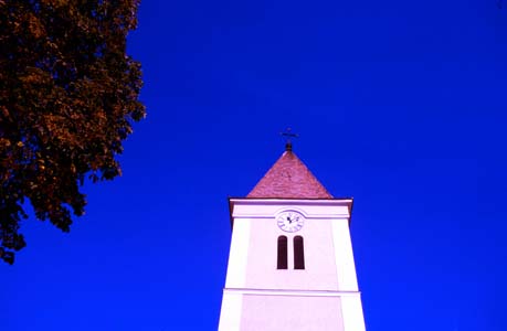 A church tower in the city surroundings