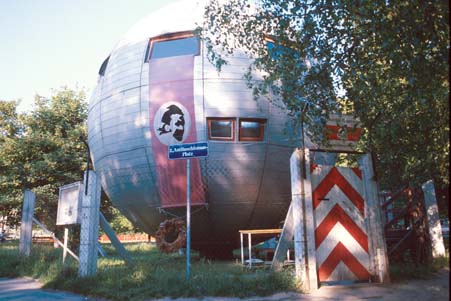 sphere in Prater was built by a guy who decided to set up his own "country" in this object, complete with barbed wire, a border check post (the red and white gate), stamps, money and passports. It says something about the Viennese sense of humour that authorities tolerate the structure.. What a prank!